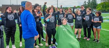 OHS Dean of Students Morley shaves head for St. Baldrick's during spring pep rally