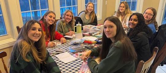 Varsity, JV basketball teams give back to Oswego