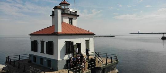 Aerial drone image of  Oswego High School students attending a field trip to the Oswego lighthouse.